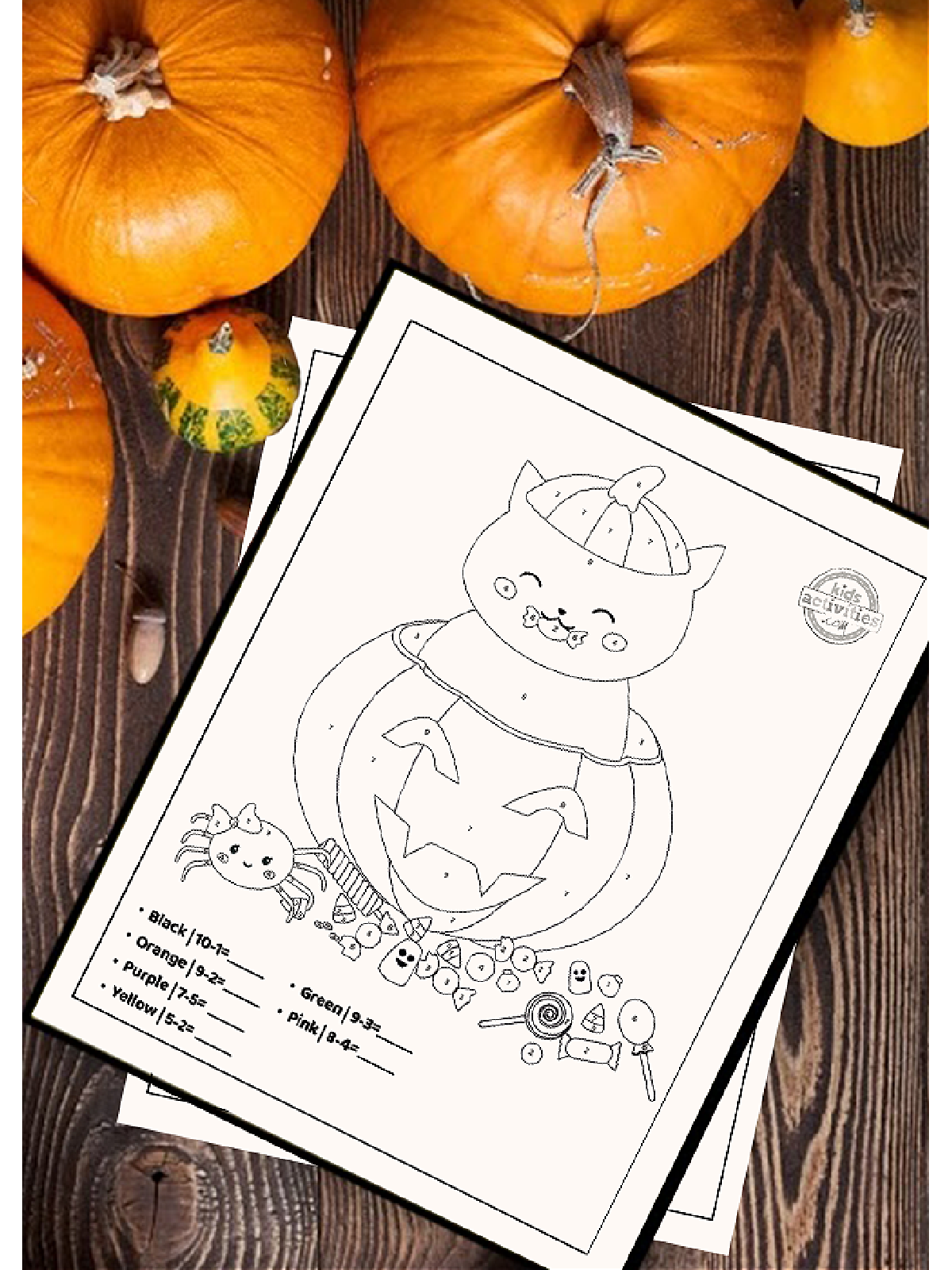 Halloween Printables- Subtraction color by number worksheet on festive background-Kids Activities Blog