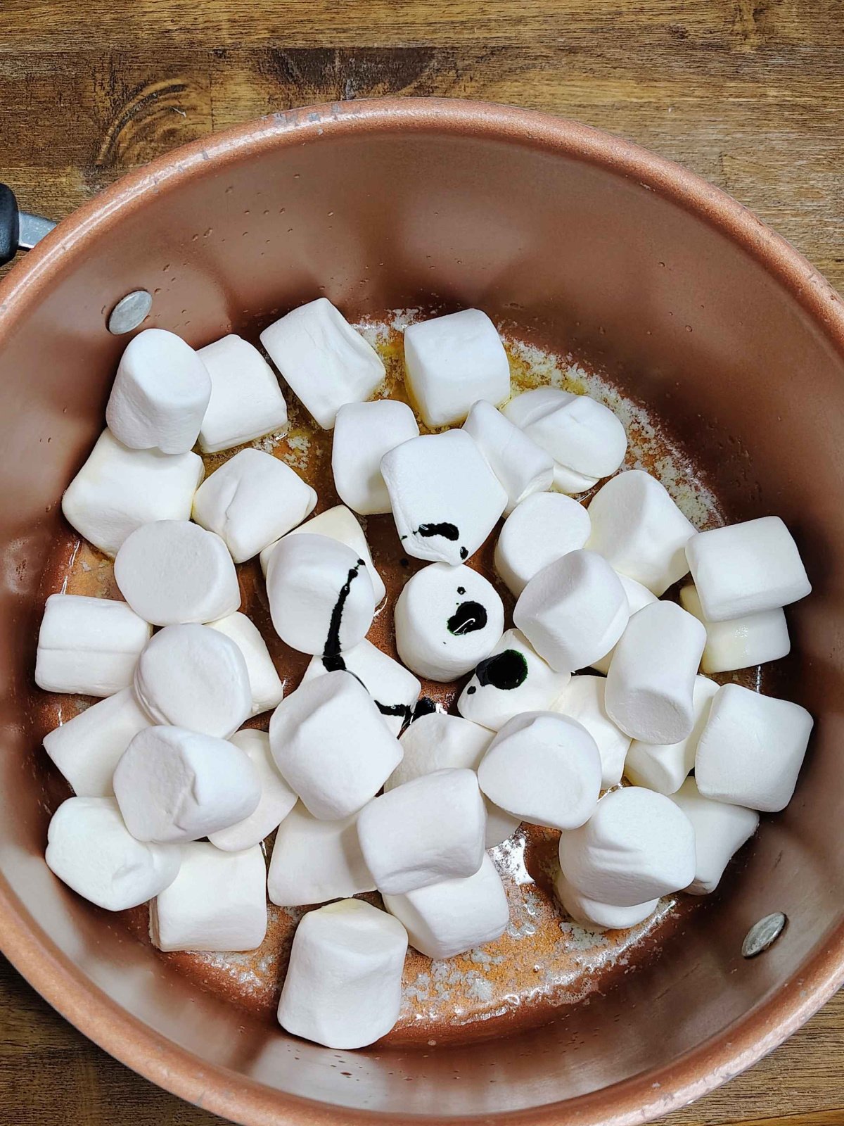 Christmas Treats- Step 2- Add marshmallows in melted butter and green dye- kids activities blog