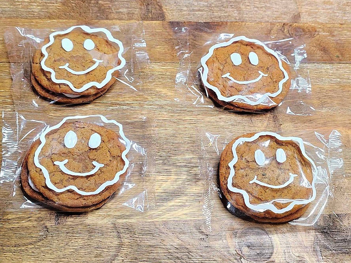 Gingerbread Man Craft- Step 2- White smiley faces painted on the cookie - Kids Activities Blog