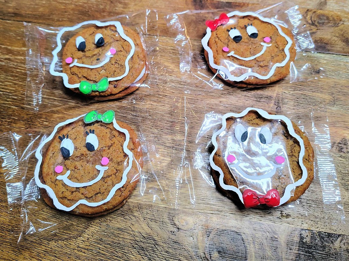 Gingerbread Man Craft- Step 4- Add green and red bows - Kids Activities Blog