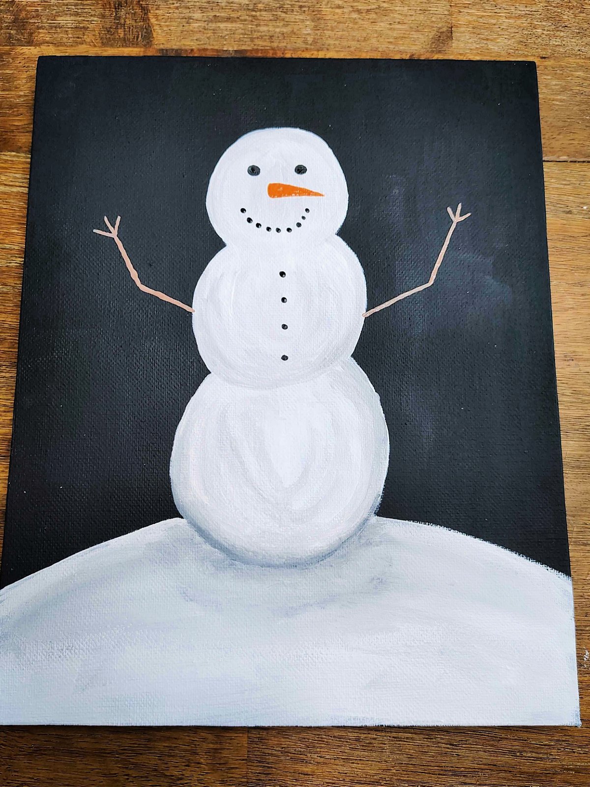 Snowman Craft- Step 6- Brown arms painted on snowman- Kids Activities Blog