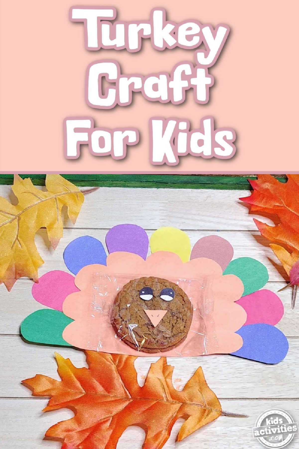 Turkey Craft- cookie with construction paper to look like a turkey with wood and leaves and text- Kids Activities Blog
