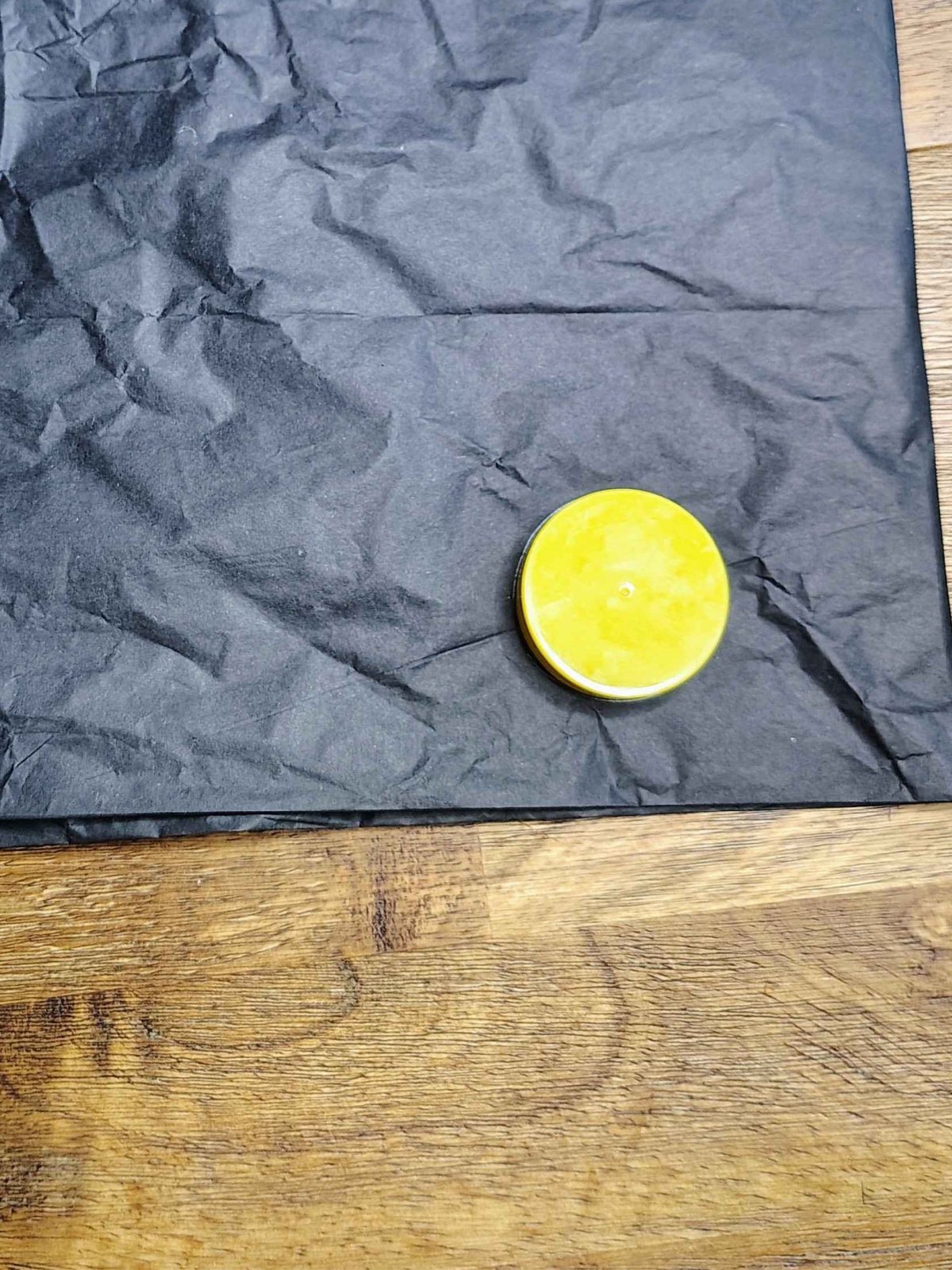 Veterans Day Poppy Craft- Step 4- Trace yellow lid on black paper- Kids Activities Blog