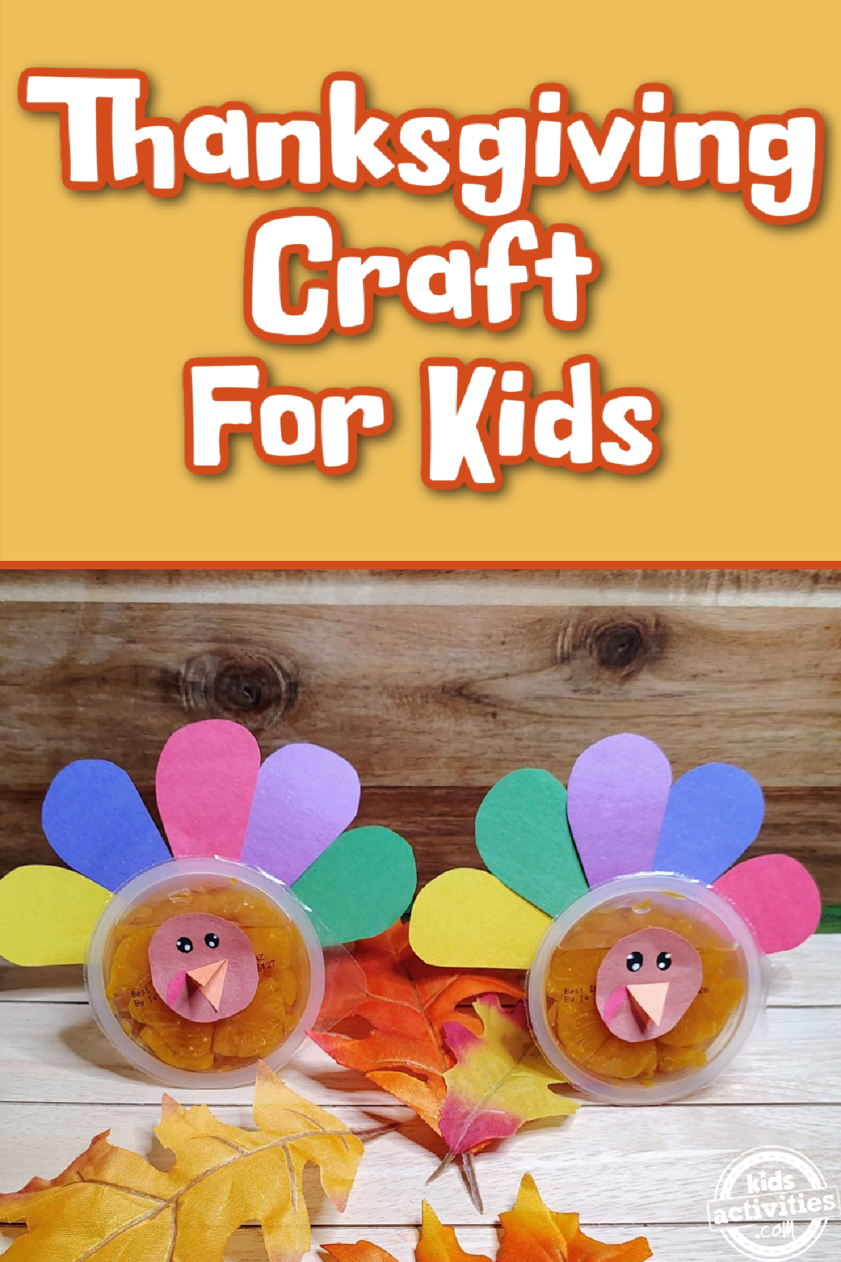 Turkey craft using construction paper and orange cups on wood background with leaves- kids activities blog