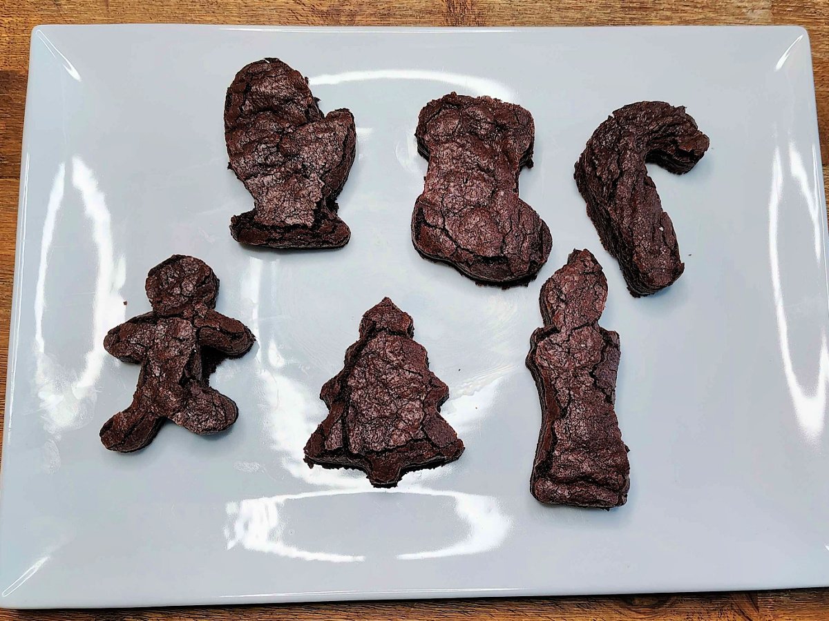 Christmas Brownies- Step 2- Brownies cut out like glove, stocking, candy cane, gingerbread man christmas tree and candle- Kids Activities blog