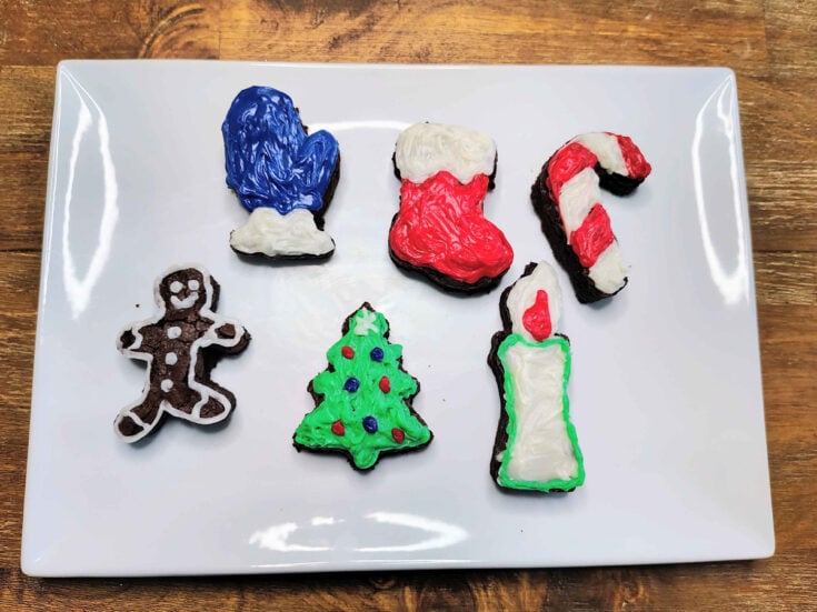 Christmas Brownies- Step 4- brownie cut outs with frosting on them- Kids Activities blog