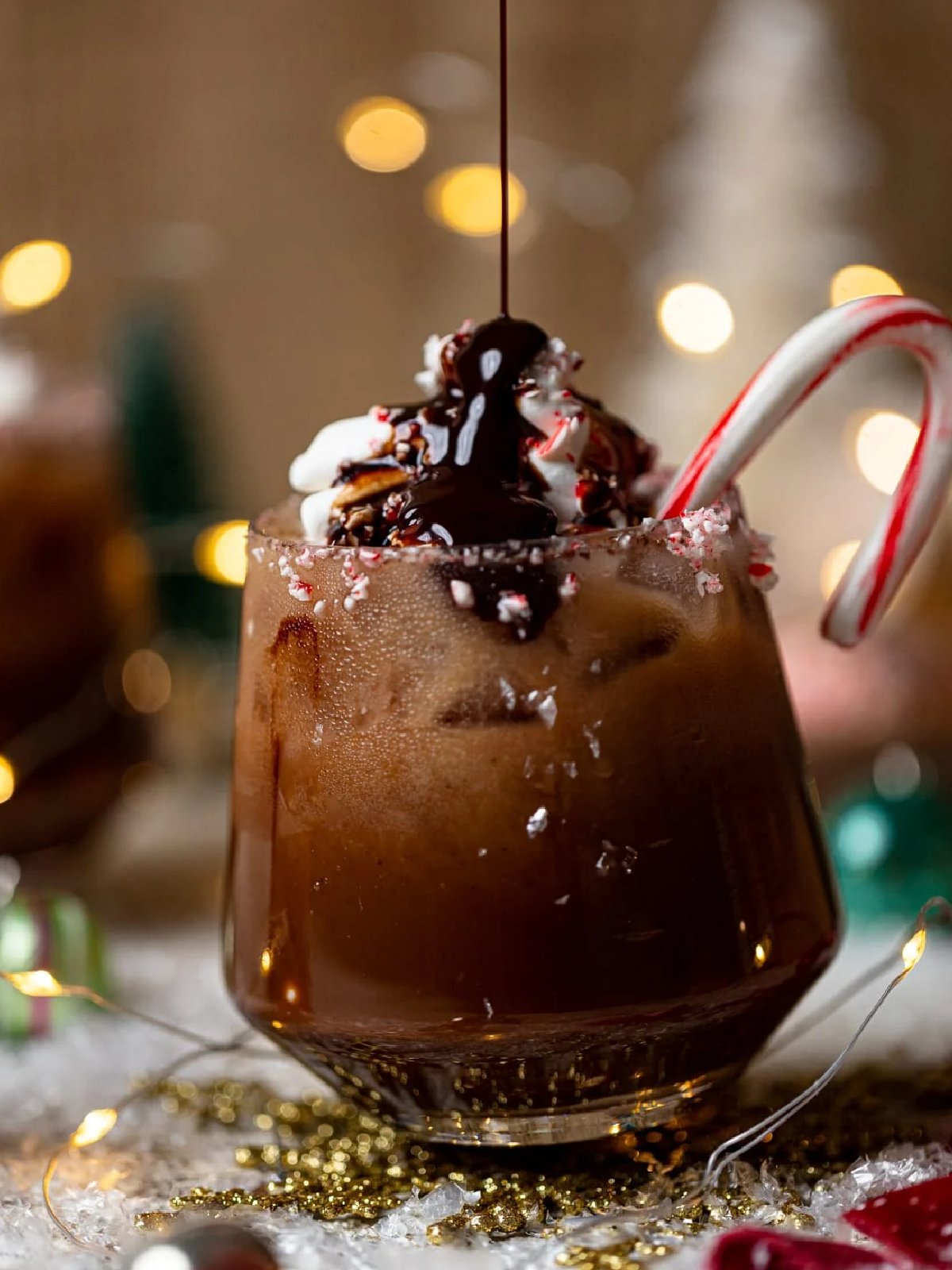 New Years Eve Mocktails- chocolate drink with chocolate drizzle and a candy cane -Kids Activities Blog