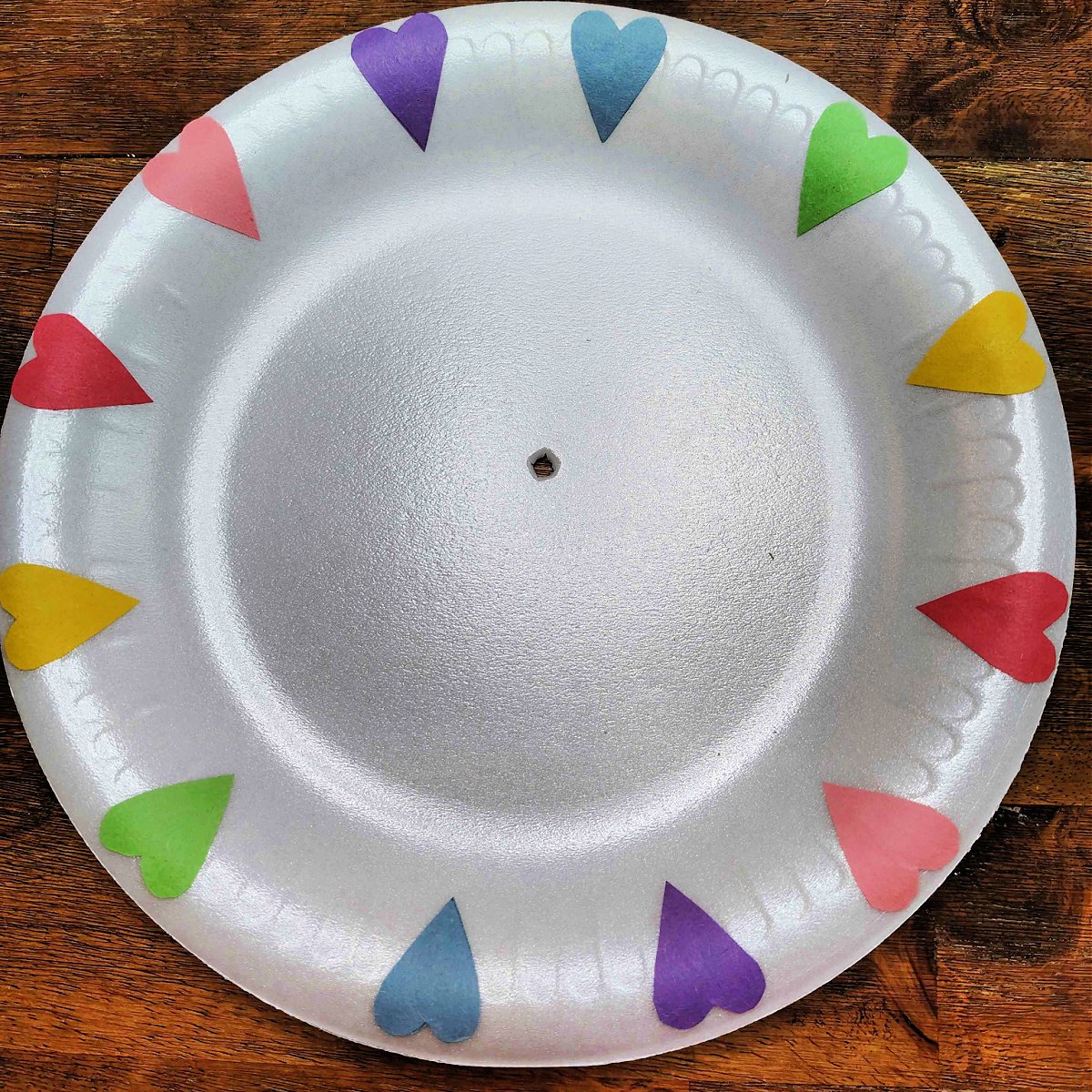 Bible Craft- Step 4- Hole poked in the middle of the foam plate - Kids Activities Blog