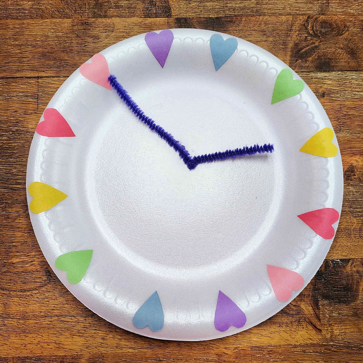 Bible Craft- Step 6- Excess trimmed off pipe cleaner making minute and hour hands- Kids Activities Blog