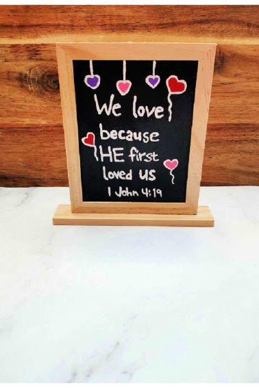 Bible Valentine Craft- Finished- Chalkboard against a wood and white background with red purple and pink hearts and text - Kids Activities blog