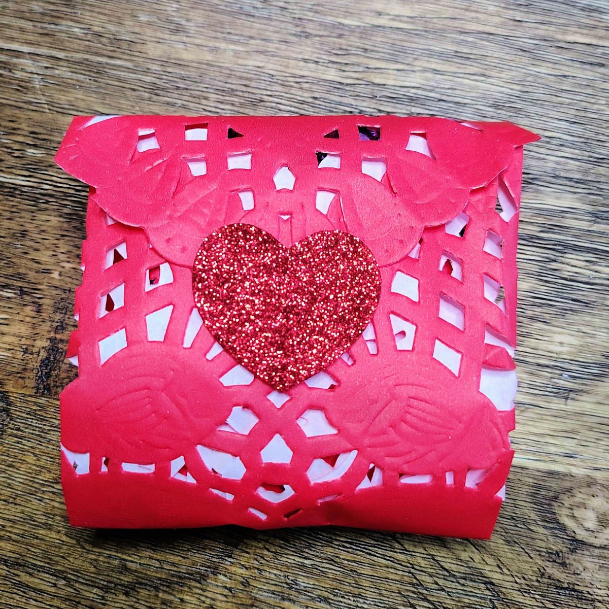 Valentines Envelopes- Step 6- Pointed top folded down and sealed with red sparkly heart sticker- Kids Activities Blog