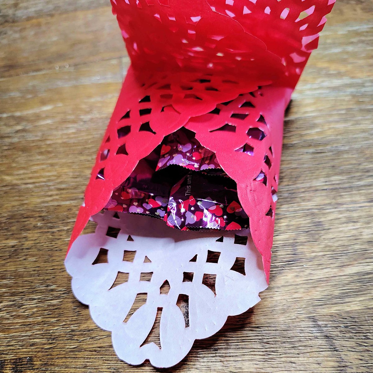 Valentines Envelopes- Step 4- candy stuffed into slot - Kids Activities Blog