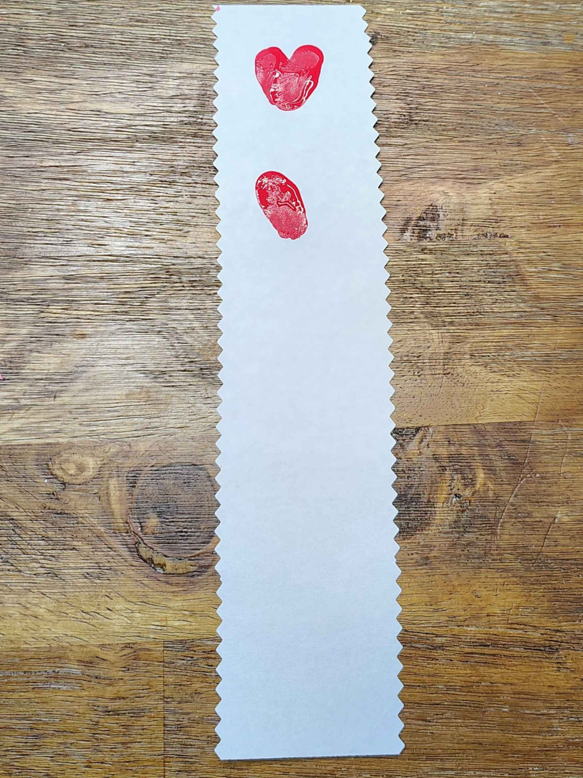 Bookmark Craft- Step 3- Hearts and half a heart using fingerprints- Kids Activities Blog