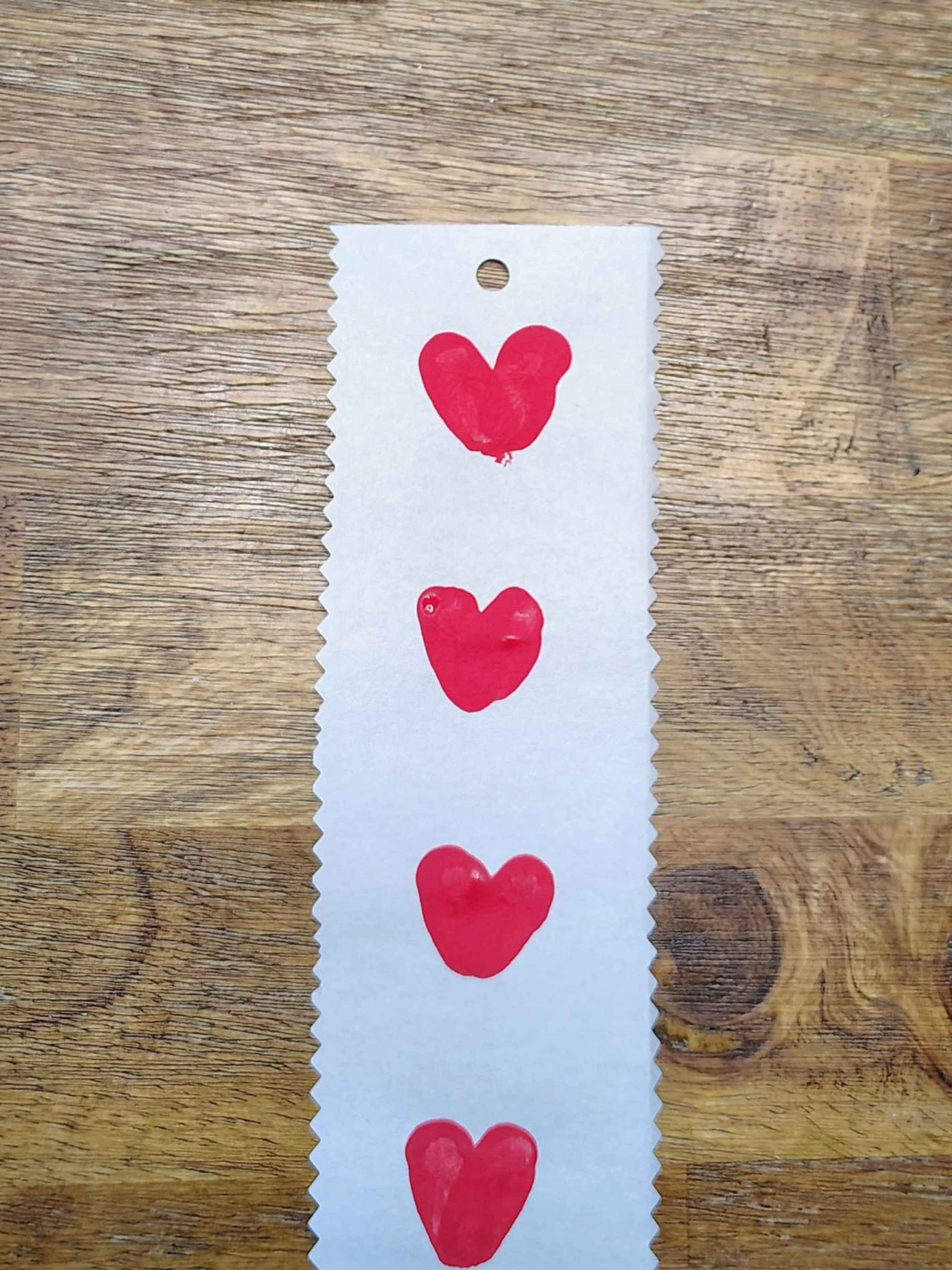 Bookmark Craft- Step 5 - Punch a hole at the top of the book mark- Kids Activities Blog