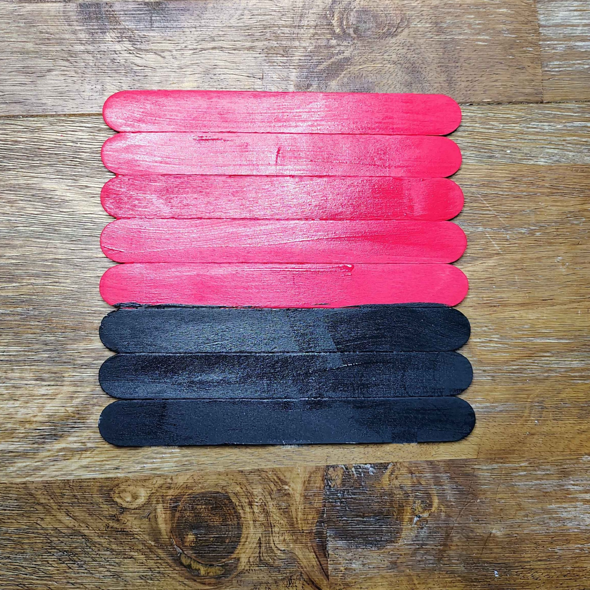 Valentine's Day Popsicle stick Craft- Step 4- Paint bottom sticks black- Kids Activities Blog