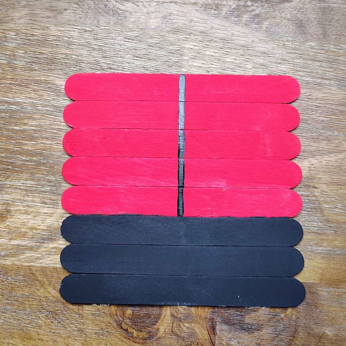 Valentine's Day Popsicle stick Craft- Step 5 - Paint a line down the middle of the red part - Kids Activities Blog