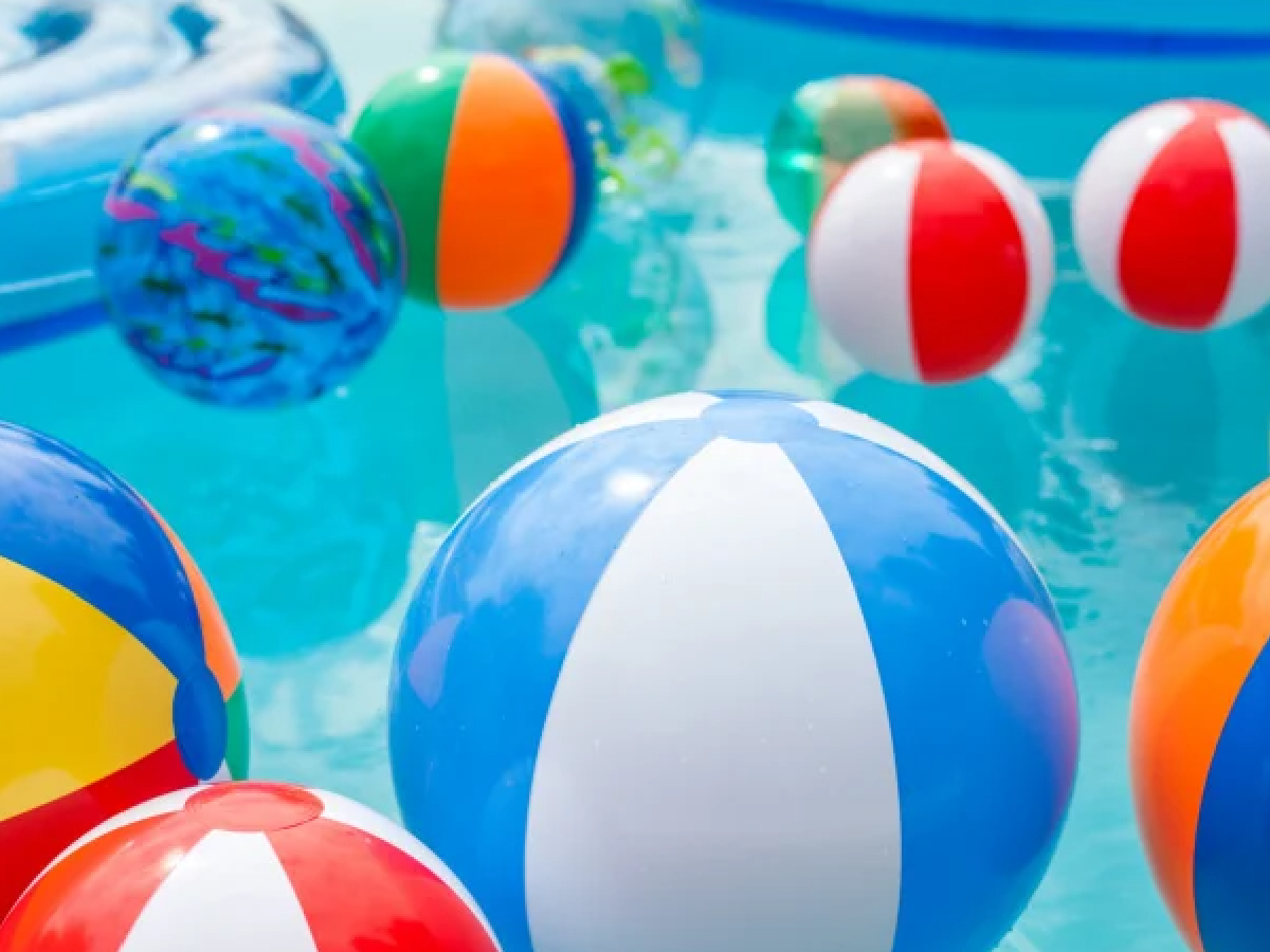 Staycation Ideas- Beach balls in a pool - Kids Activities Blog