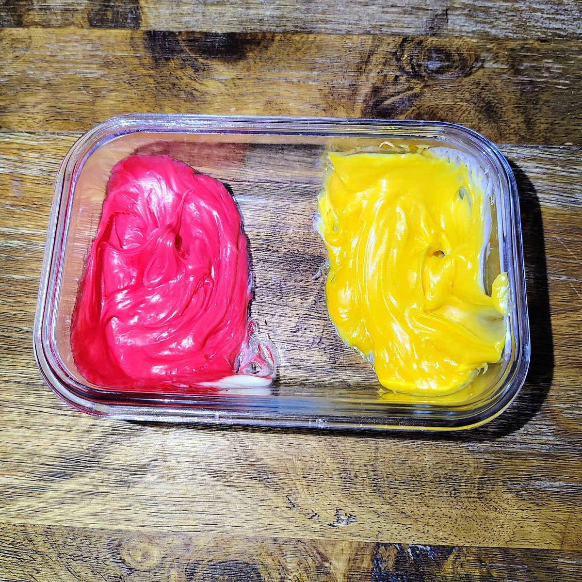 Twinkie Corn Dog- Step 1 - Red and yellow frosting in a bowl -Kids Activities Blog