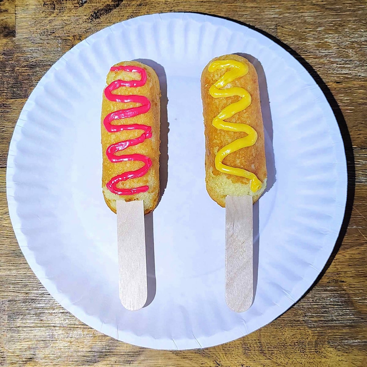 Twinkie Corn Dog- Step 4- Red and yellow frosting on twinkies-Kids Activities Blog