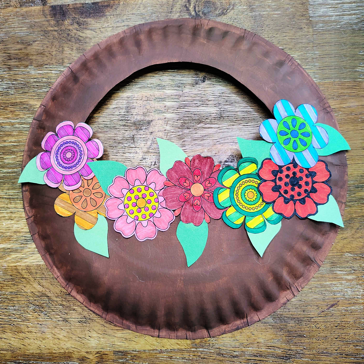Flower basket craft- Step 6 - Add leaves to the flower basket- Kids Activities Blog