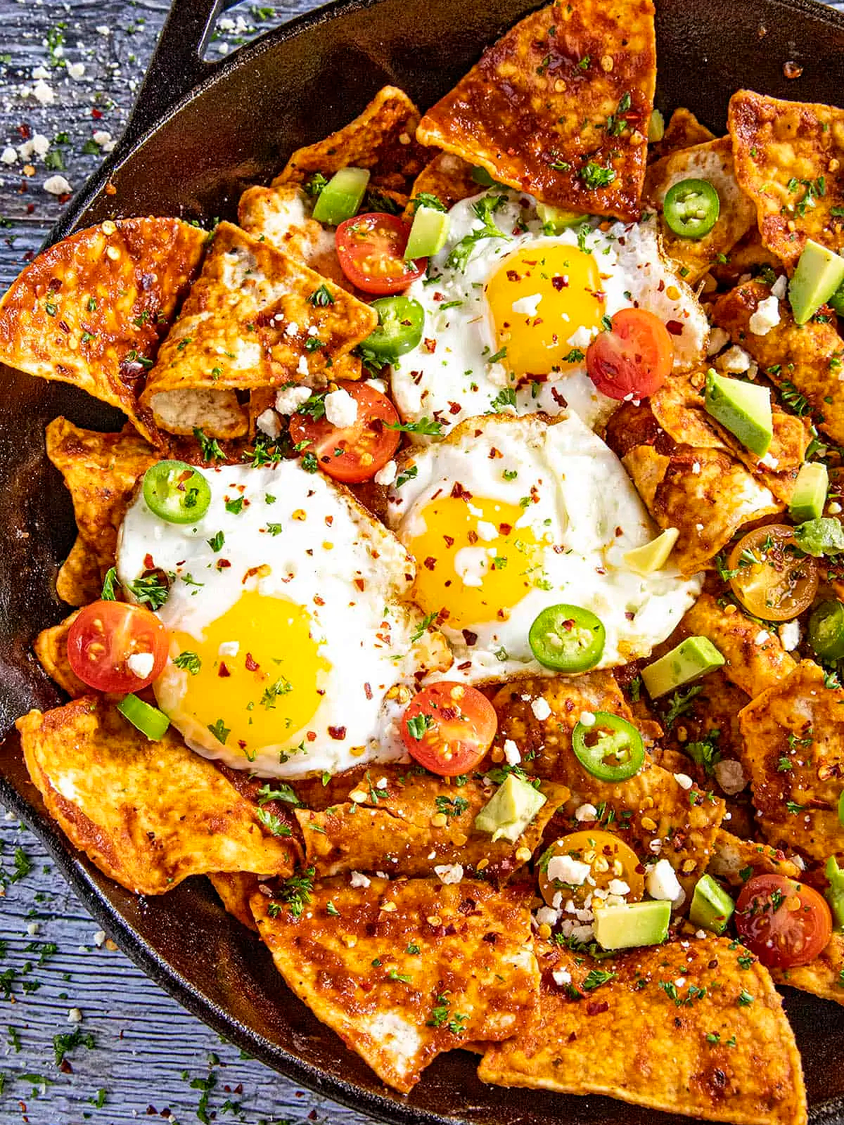 Mother's Day Breakfast Recipes- Chilaquiles on a plate with eggs and chips - Kids Activities Blog