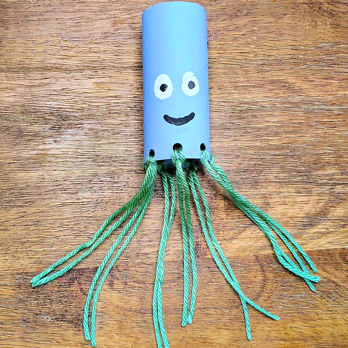 Toilet Paper Roll Octopus Roll- Step 7- Do it for all the holes-Kids Activities Blog