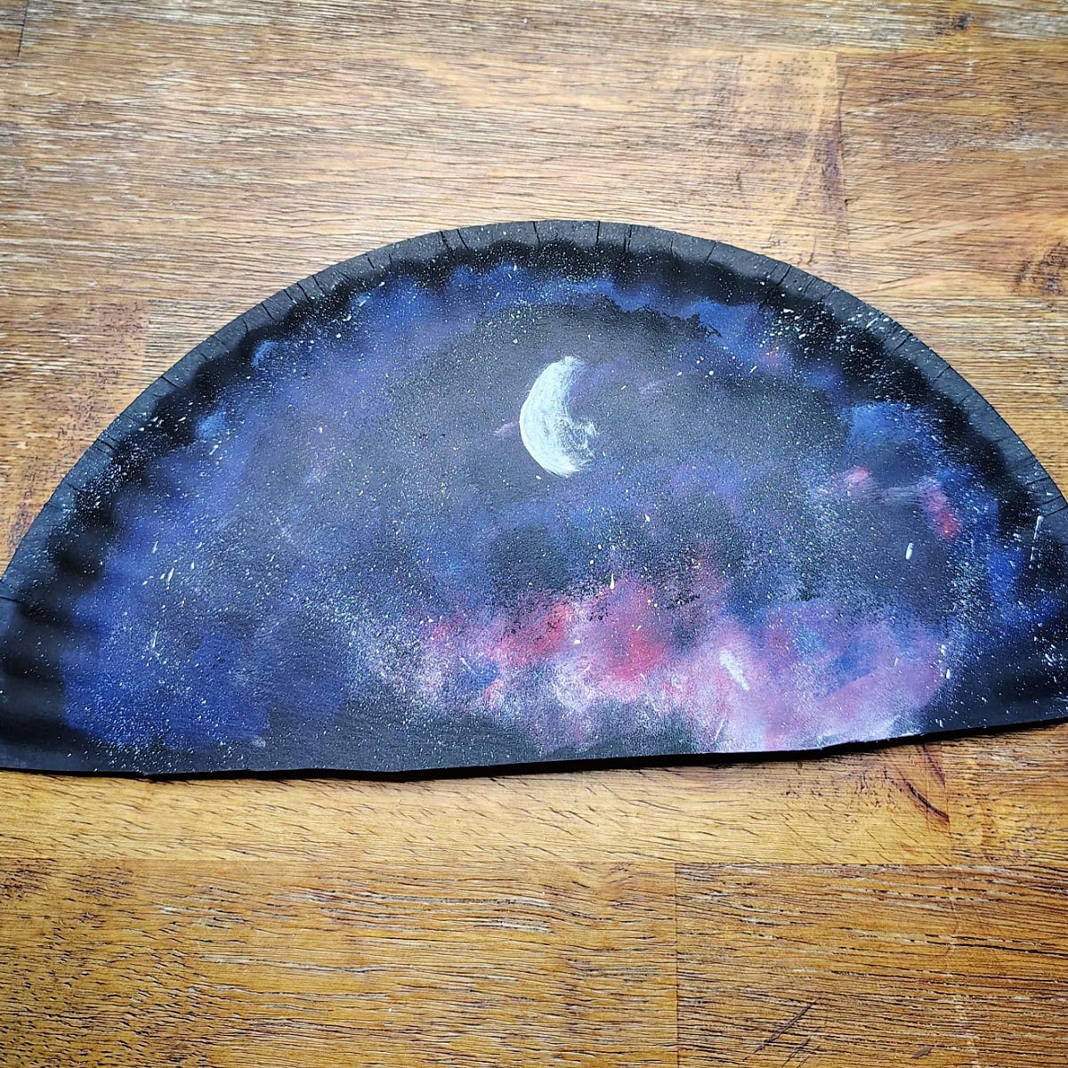 Paper Plate Fan- Step 7 - Paint a white crescent moon. -Kids Activities Blog