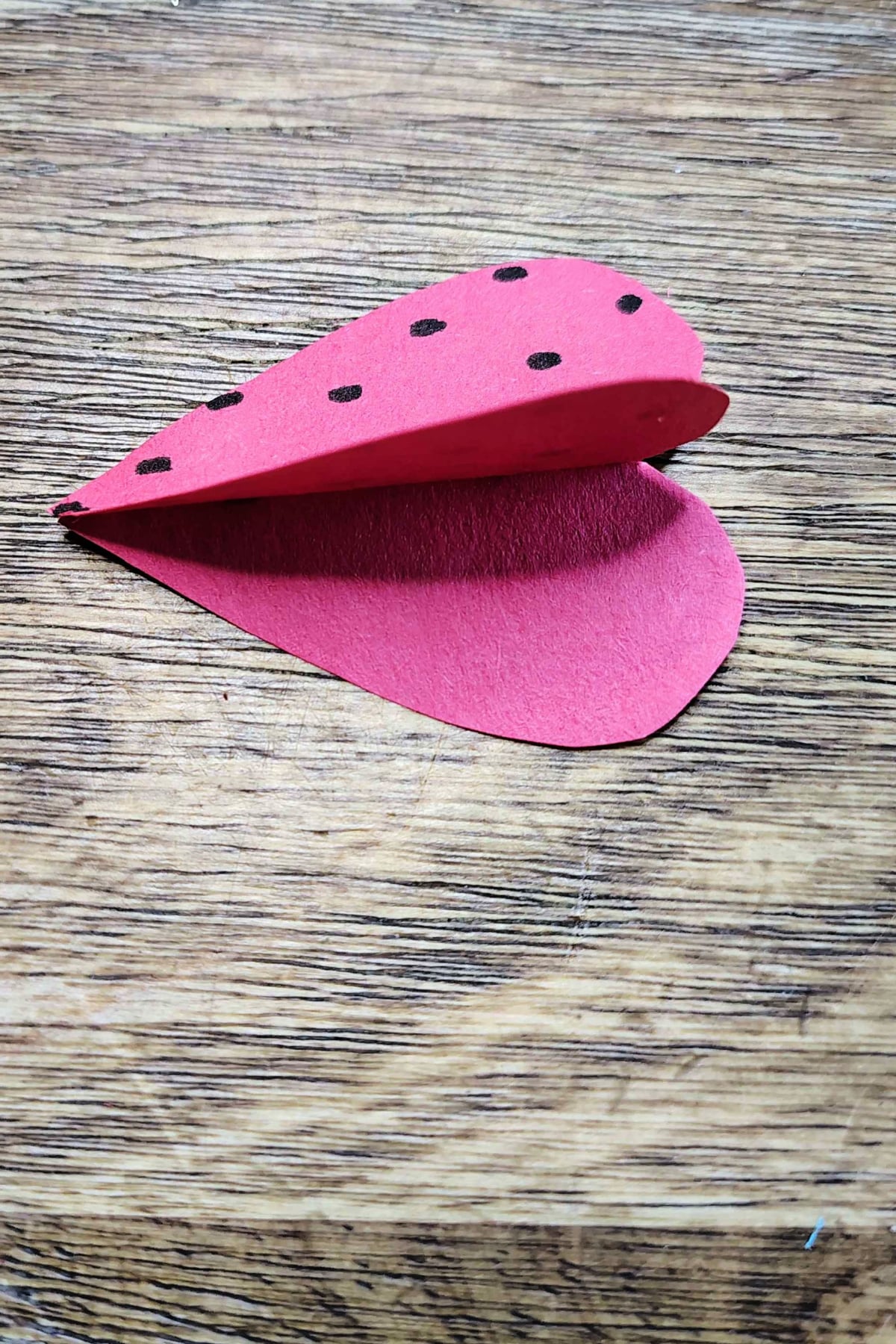 Strawberry Craft- Step 3- Glue plain side of hearts together only 1/2- Kids Activities Blog