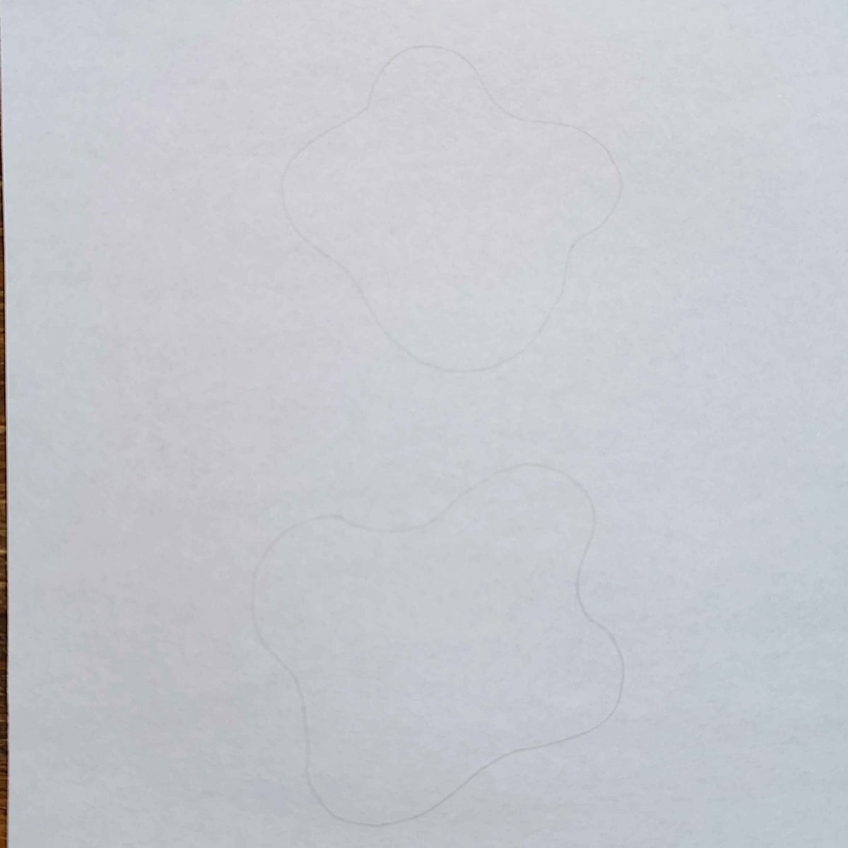 Breakfast Paper Plate Craft- Step 3 - Sketch out the egg whites on white paper- Kids Activities Blog