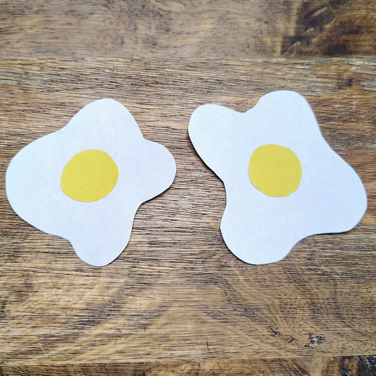 Breakfast Paper Plate Craft- Step 5- Glue the yolk on the egg whites- Kids Activities Blog