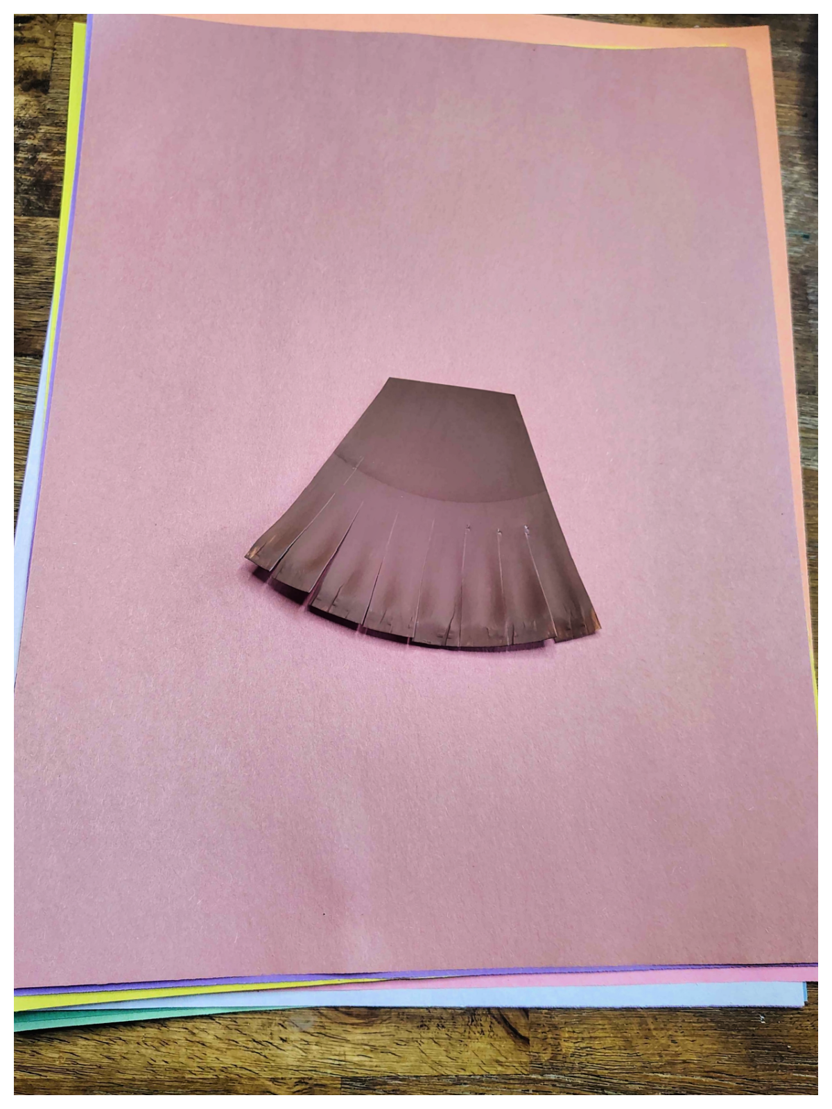 Leaf Craft- Step 4- teeth cut into rake head and the tip cut off- Kids Activities Blog