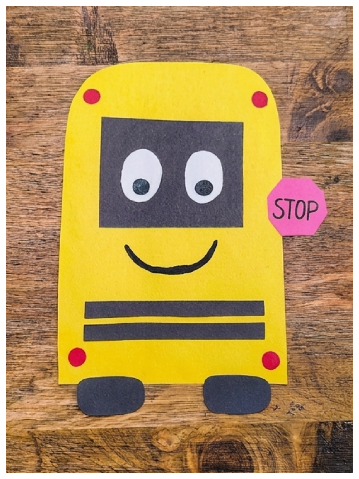 Paper School bus craft- Step 7- face and lights put on school bus- Kids Activities Blog