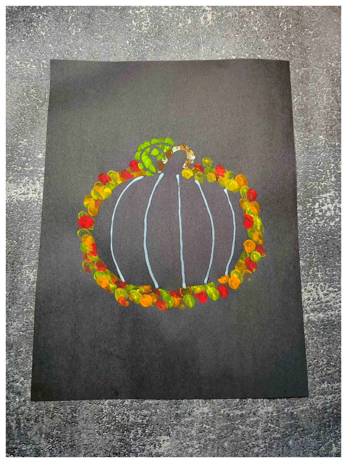 Pumpkin Craft- Step 4 - Add vertical stripes of glue- Kids Activities Blog