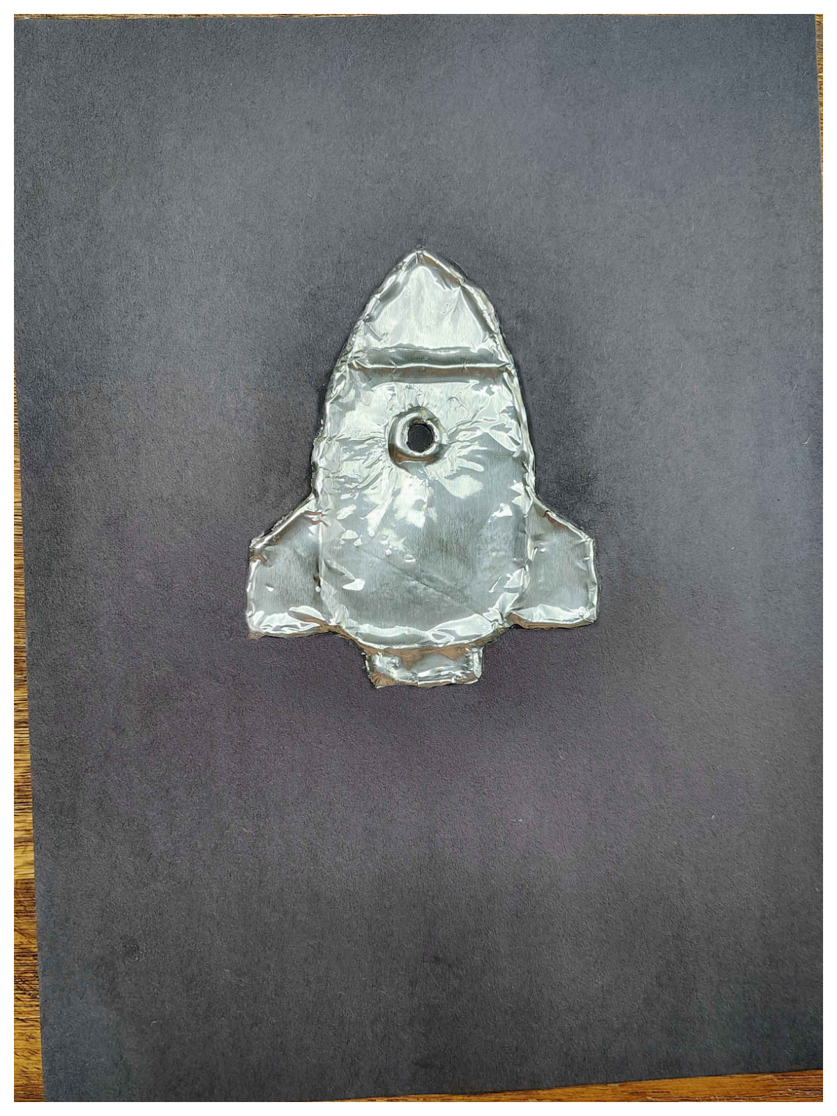 Rocket Craft- Step 3- Rocket ship covered with tin foil -Kids Activities Blog