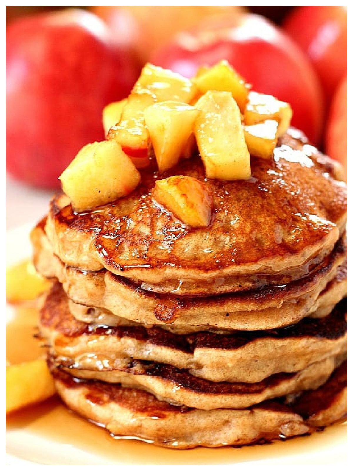 Apple Cider Recipes- pancakes with apples in the background and diced apples on top -Kids Activities Blog