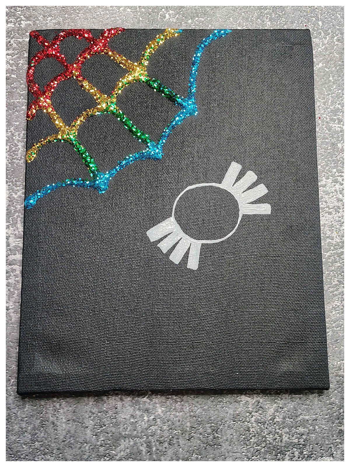 Spider Web Craft- Step 5- spider stamped on black canvas-Kids Activities Blog